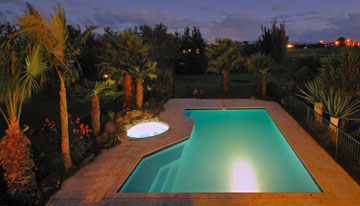 The swimming pool lit up at night