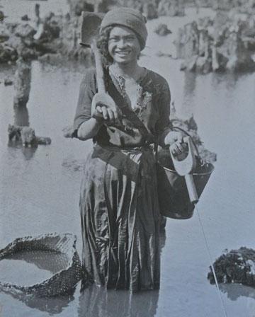 Maori girl working in the swamps