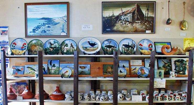 A selection of pots and hand-painted platters on display in the pottery