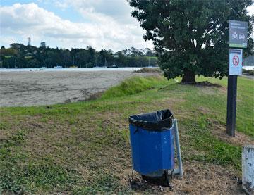 Grass area with rubbish collection