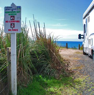 No camping sign overlooking Henderson Bay.