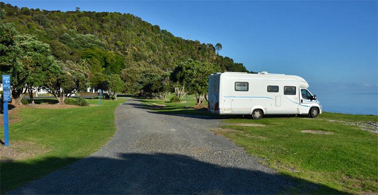 Parking along the beachfron between the freedom camping signs