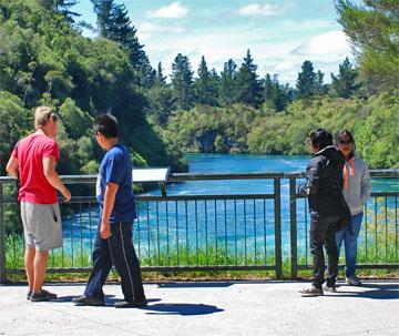Visitors on bridge over the Waikato river