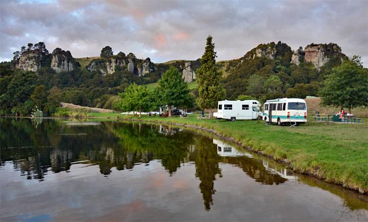 Parking at the river's edge with a dramatic backdrop