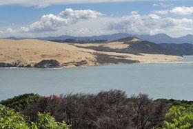 View over harbour and sand dunes from Opononi