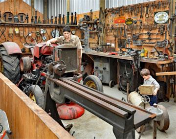 Father and son in their farm workshop