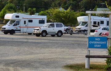 large parking area set back from the beach