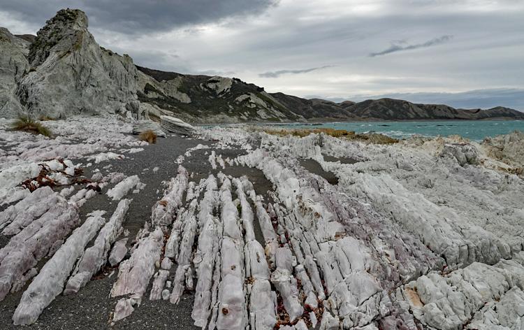 Pink rock formations at the northern end of Ward Beach