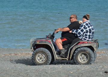 Beach buggy driving up the beach