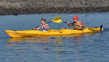 Father and daughter out kayaking