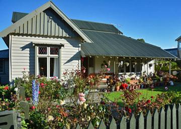 Picturesque cottage surrounded by flowers