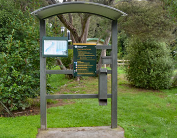 DOC sign and honesty box for pay campsite fees