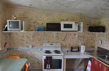 Kitchen -with graffiti decorated walls and ceiling