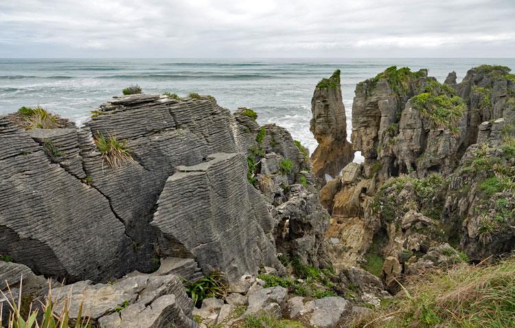 Pancake rock formation with the Tasman sea in the background