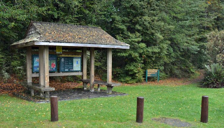 Noticeboard and shelter at the entrance to a walking track