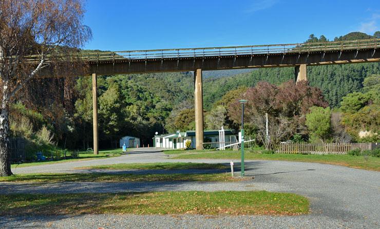 Park separated by an overhead railway bridge