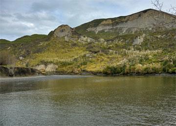 The Waikare River flowing towards the beach